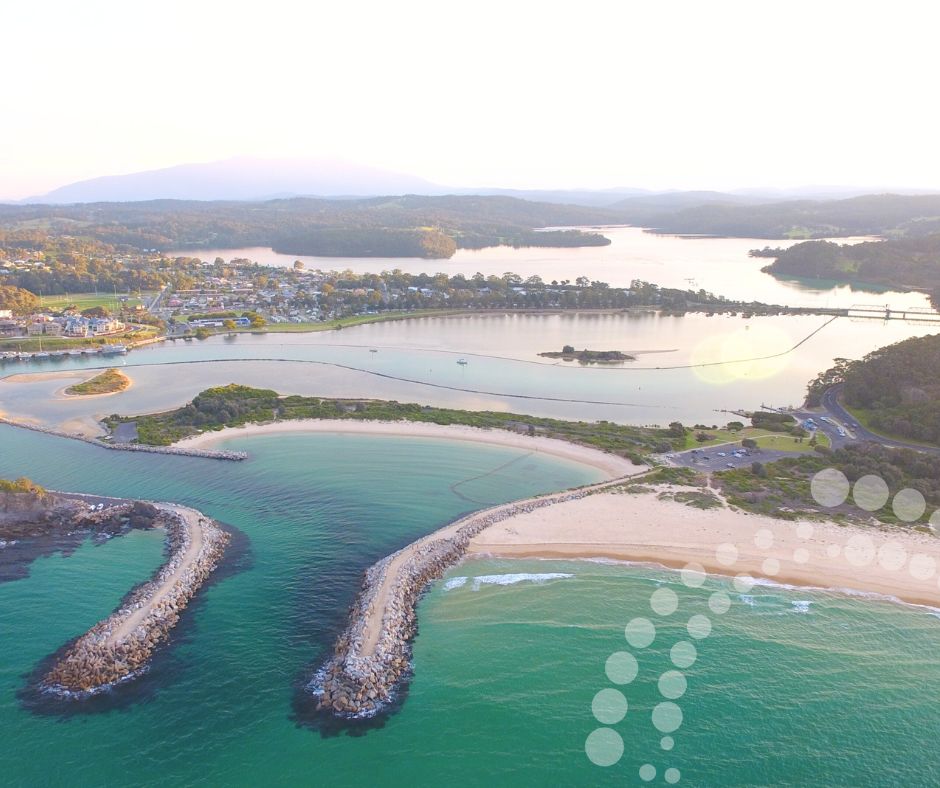 Aerial photo of Narooma featuring the Wagonga Inlet and Gulaga in the background.